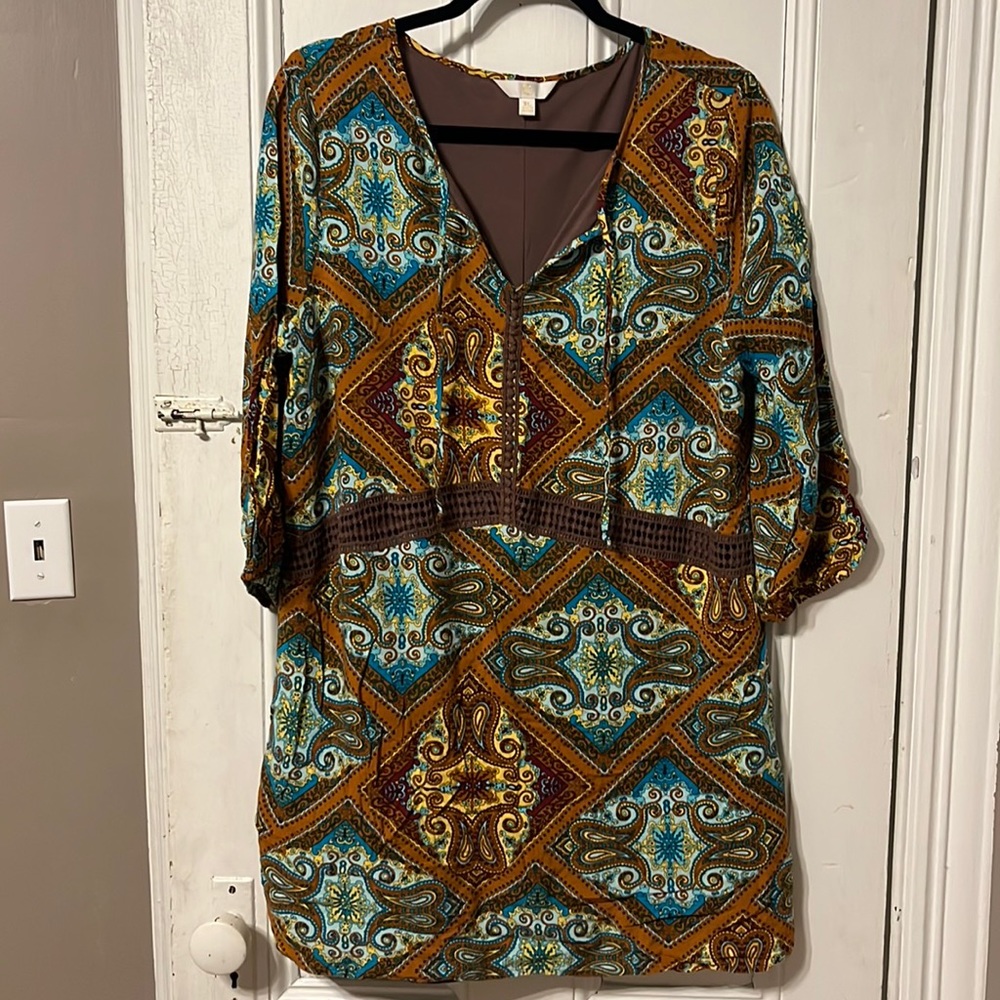 Mini dress bohemian style. Three-quarter length sleeves